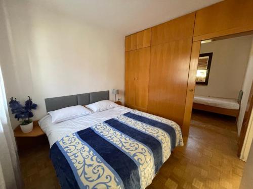 a bedroom with a large bed with a wooden headboard at Terme Čatež apartma Solist 