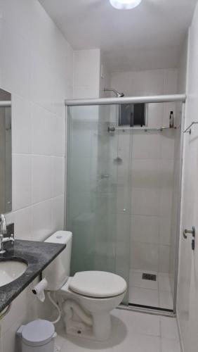 a bathroom with a shower and a toilet and a sink at Locação por Temporada e Cop 30 in Ananindeua