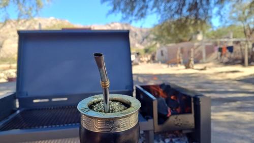 a pot with a stick in it sitting in a truck at Rancho Grande in Santa María