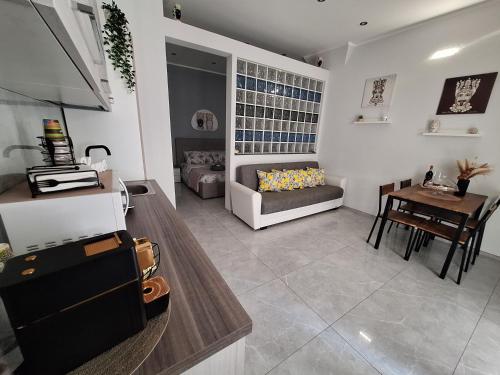 a living room with a couch and a table at Casa vacanze al teatro in Catania