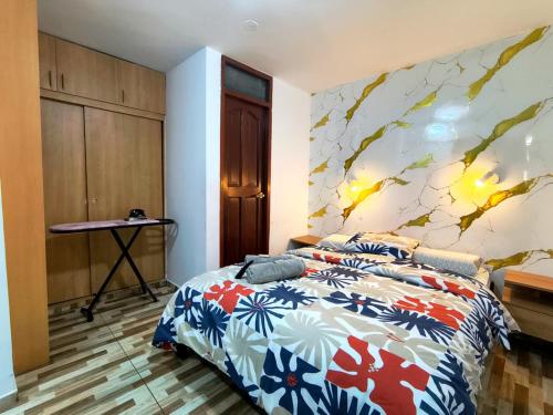 Un pat sau paturi într-o cameră la Apartamentos "APPART D'ELIETTE"