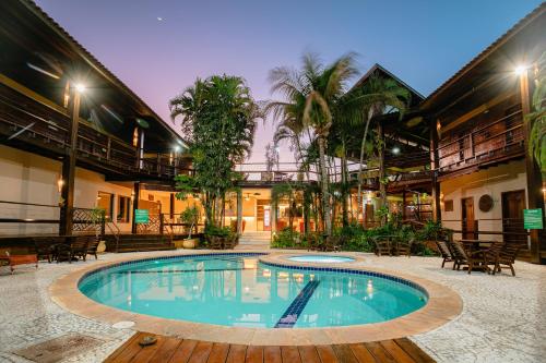 a swimming pool in the middle of a building at Hotel Pirá Miúna in Bonito