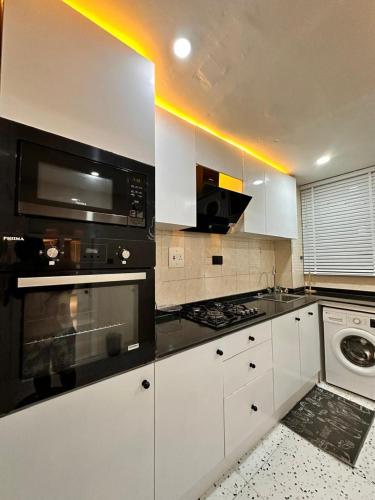 Η κουζίνα ή μικρή κουζίνα στο The Rosemont - Jeffreys Apartments