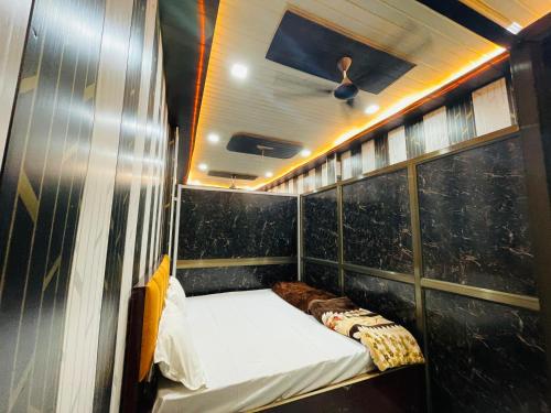 a small bed in the back of a boat at My Perfect Stay in Ayodhya