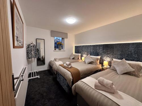 Ένα ή περισσότερα κρεβάτια σε δωμάτιο στο Spacious 3 Bedroom City Center Flat in Derby with Parking