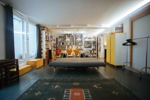 a large room with a bed in the middle of it at Spacious Chillout in Madrid in Madrid