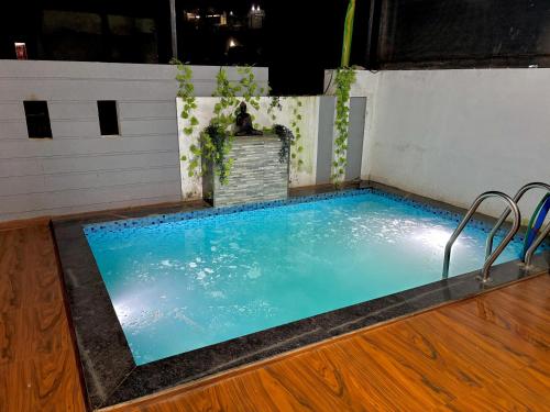 a swimming pool in the middle of a floor at prahi villa 3bhk in Lonavala