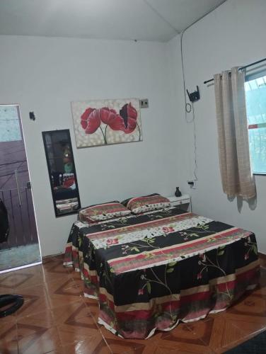 a bedroom with a bed in a room at Cantinho Amazônico Cop 30 in Belém