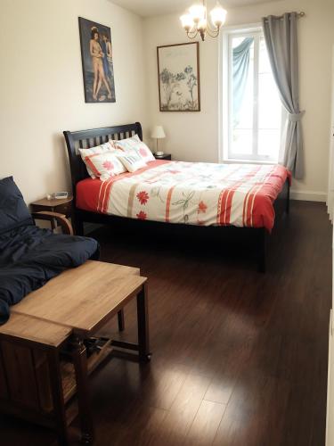 a bedroom with two beds and a window at Maison Montplaisir in Montreal