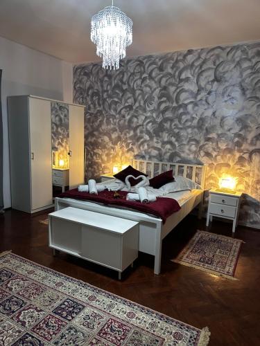 En eller flere senge i et værelse på Velvet Sforii Residence