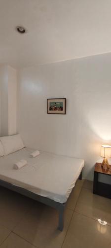 Postel nebo postele na pokoji v ubytování Z and J Transient House l- CDO