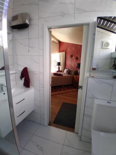 a bathroom with a sink and a toilet in a room at The Tawnys in Russell