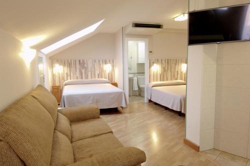 Posteľ alebo postele v izbe v ubytovaní Hotel Apartamentos Aralso