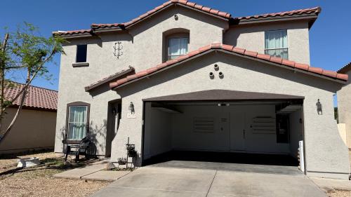 a large house with a garage in front of it at 12 min to Phoenix Raceway Perfect for Large groups &Work in Cashion