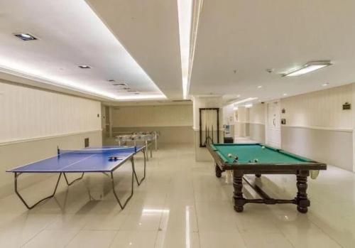 two ping pong tables in a large room at Chateau Libertador Sophisticated 4 bedroom high floor river view large private terrace in Buenos Aires