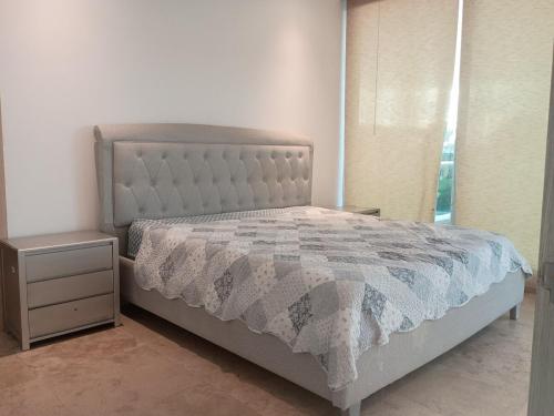 Giường trong phòng chung tại Resort frente al mar