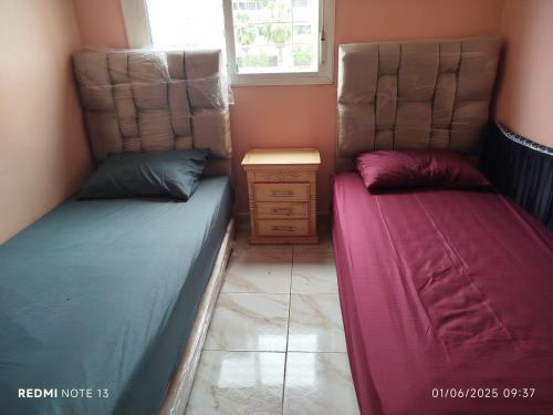 Ένα ή περισσότερα κρεβάτια σε δωμάτιο στο Appartement Salé Doha Layayda