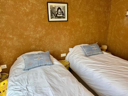 Ένα ή περισσότερα κρεβάτια σε δωμάτιο στο Riad Lalla Naty