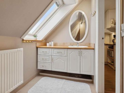 a bathroom with a sink and a mirror at 5 star holiday home in Allinge in Allinge