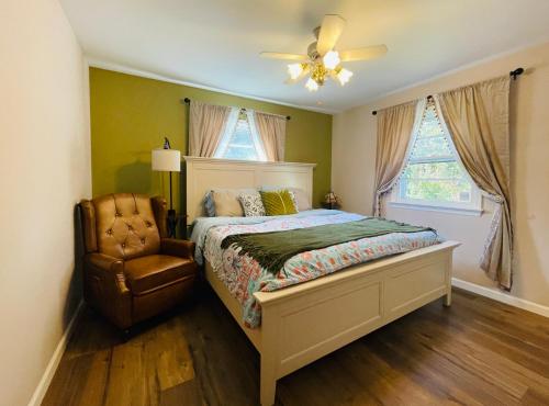 a bedroom with a bed and a fan and a chair at Private Estate, Walk to Princeton Downtown, 3-Bedrooms 2-Bath with Free Parking in Princeton