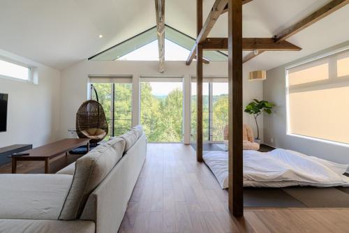 Postel nebo postele na pokoji v ubytování Hakuba Villa Kasumi