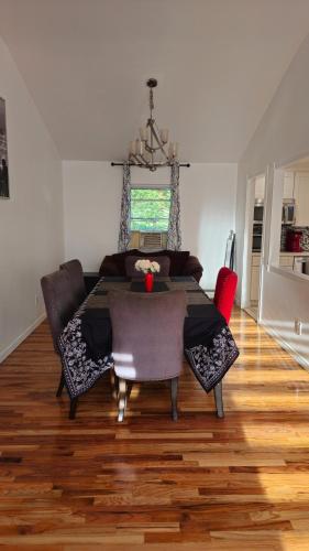 a dining room with a table and chairs in a room at 3 bedrooms in Deer Park