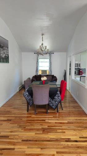 a living room with a table and a couch at 3 bedrooms in Deer Park