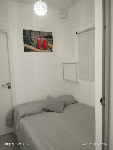 En eller flere senge i et værelse på Departamento La Perla