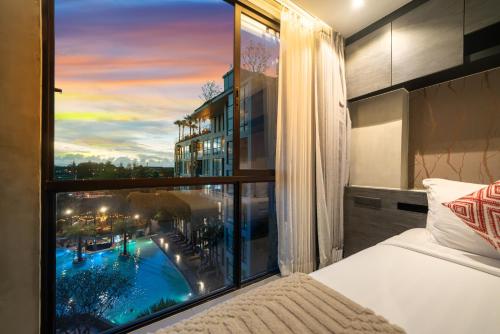 Ένα ή περισσότερα κρεβάτια σε δωμάτιο στο 5 Stars Facilities Condo Kamala Beach