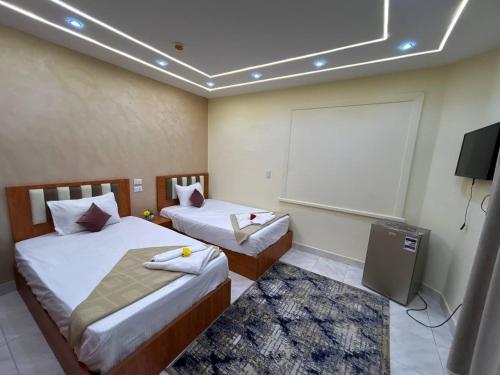 Garden City inn Hotelにあるベッド