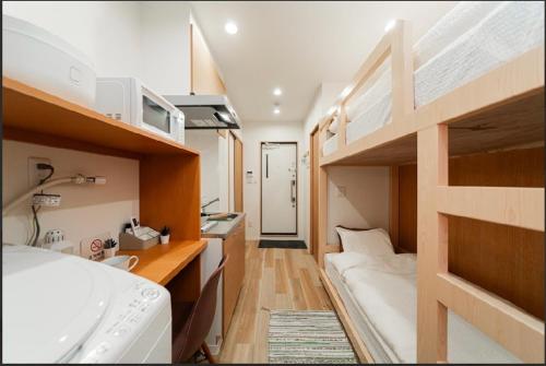 a small room with a bed and bunk beds at Sunlight Room3-2 in Tokyo
