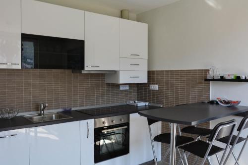 Kuchyňa alebo kuchynka v ubytovaní Nautika Apartment