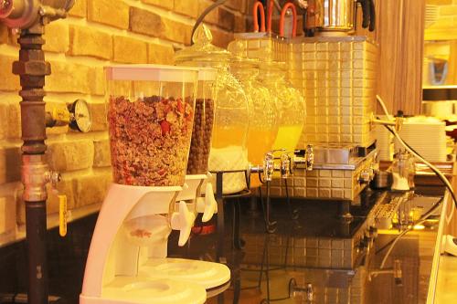 a kitchen with a food processor filled with food at Nun Hotel in Konya