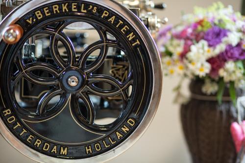 a black and gold plate with flowers in vases at Buccara Apartments Kitzbühel in Kitzbühel