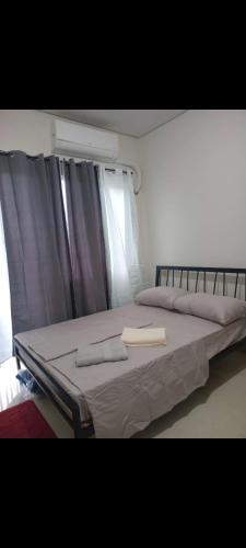 En eller flere senge i et værelse på Style Residences UNIT 130 A