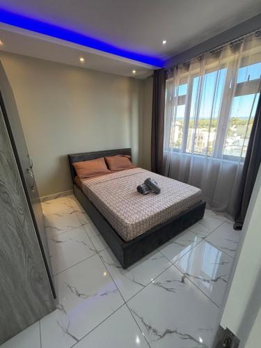 a bedroom with a bed in a room at 3 BD Luxury Beachfront Penthouse in Flic-en-Flac