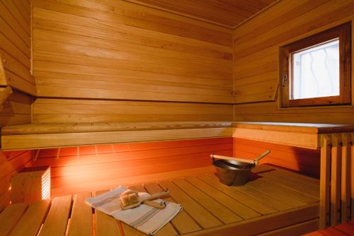 an inside view of a wooden sauna with a tub at Villa Amarandes With Private Pool in Paradeísion