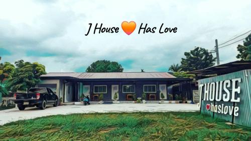 a house with a car parked in front of it at J House Has Love in Sukhothai