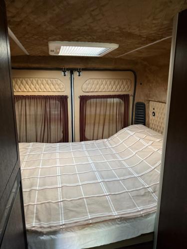 a bed in the back of an rv at Hotel auf Räder in Wangen im Allgäu