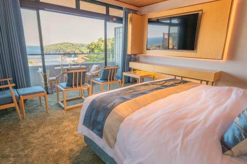 Ένα ή περισσότερα κρεβάτια σε δωμάτιο στο Tsuru Yoshikawa Onsen