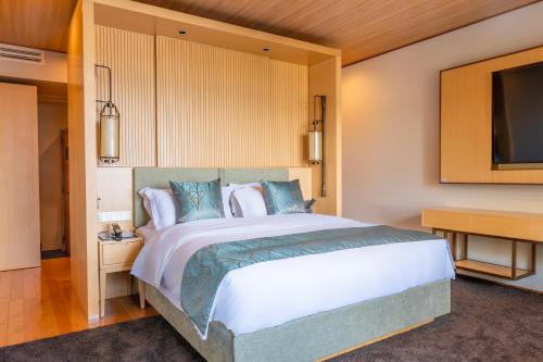 Ένα ή περισσότερα κρεβάτια σε δωμάτιο στο Tsuru Yoshikawa Onsen
