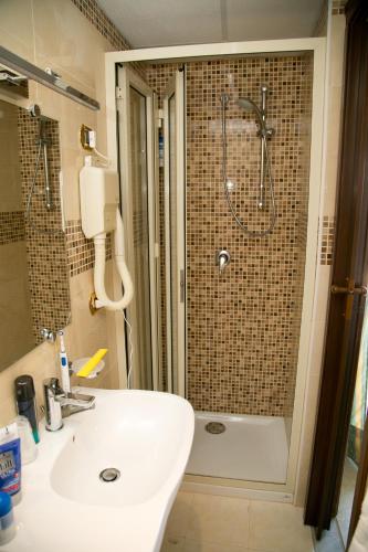 a bathroom with a shower and a sink and a shower at Hotel Villa Bianca Resort in Taormina