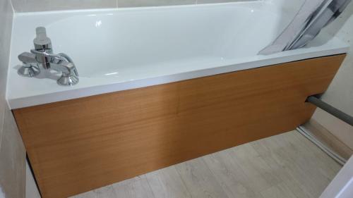 a bathroom sink with a wooden drawer in a bathroom at Chalet Robinson, a 20 km de Disney et 50 de Paris - SNCF in Mortcerf