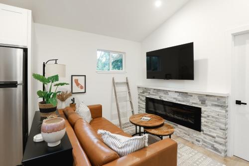 a living room with a couch and a fireplace at Tranquil Mountain Retreat in Santa Cruz in Santa Cruz