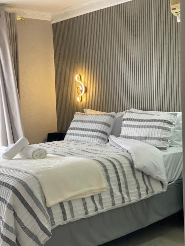 Ένα ή περισσότερα κρεβάτια σε δωμάτιο στο Nono's Boutique Guesthouse