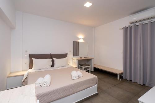 Postel nebo postele na pokoji v ubytování Hotel Galini Sifnos