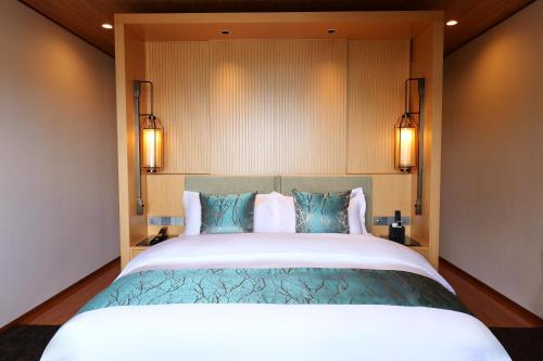 Ένα ή περισσότερα κρεβάτια σε δωμάτιο στο Tsuru Yoshikawa Onsen