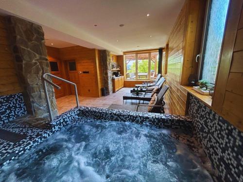 a hot tub in the middle of a house at Chalupa Štikov v Podkrkonoší in Nová Paka