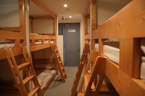 a group of bunk beds in a room at 2-times,Dormitory Hotel - Vacation STAY 55232v in Itoshima
