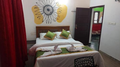 a bedroom with two beds with dolls on them at Pearl House Residency in Jāmb